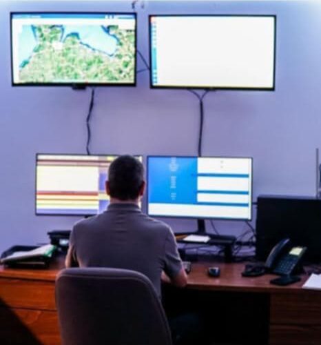 Staffed dispatch desk with mapping and call-taking screens